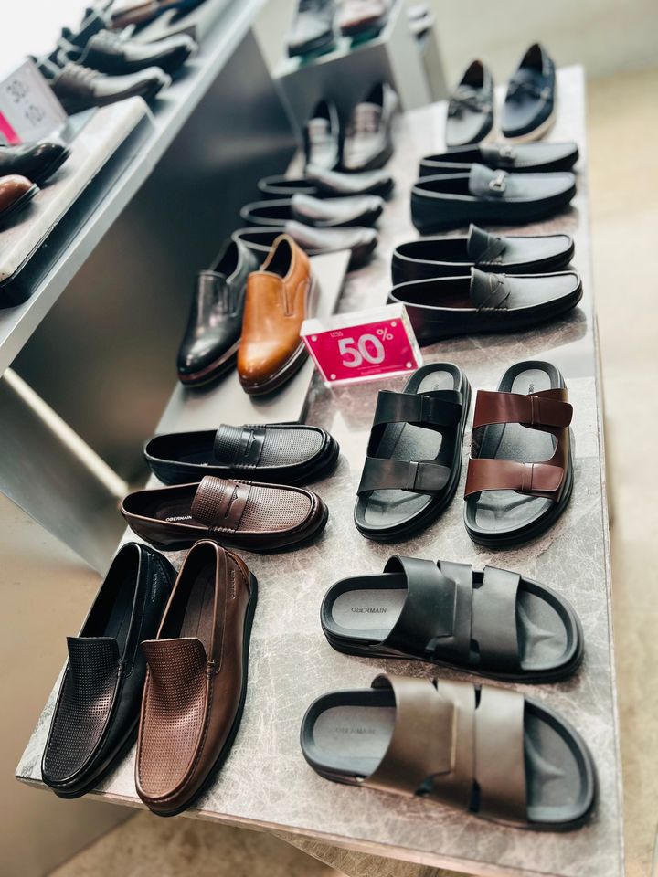 Stylish men's shoes displayed on a shelf